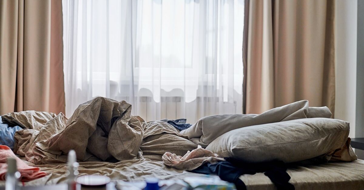 Unmade bed in a dust-prone room