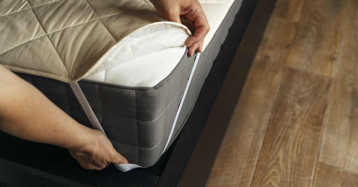 Clean bed prepared with mattress protector