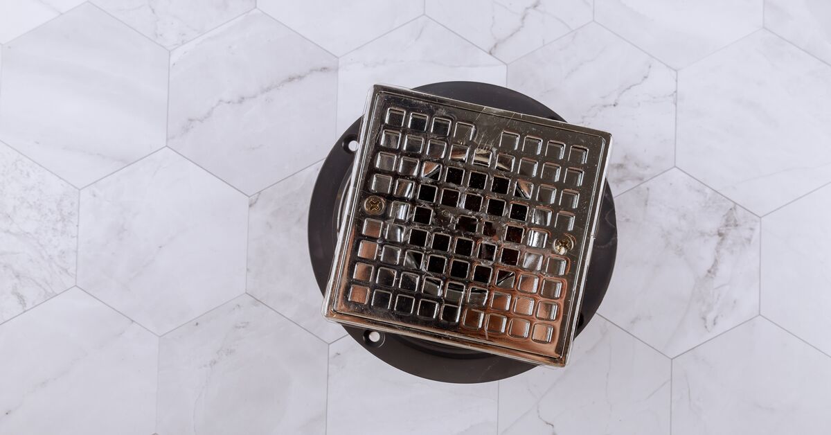Shower drain protected with a strainer