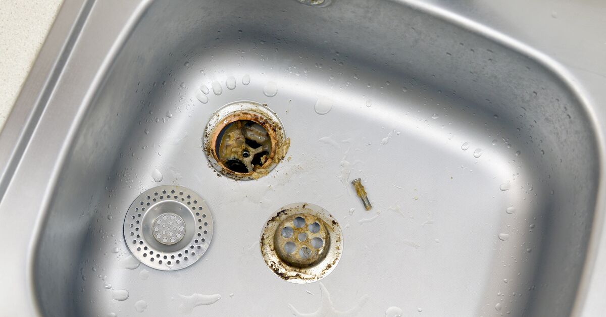 Clogged sink drain with visible buildup