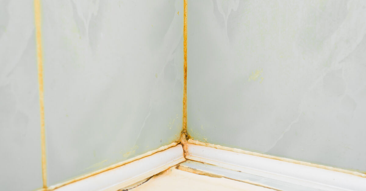 Yellowed tile joints in shower corner