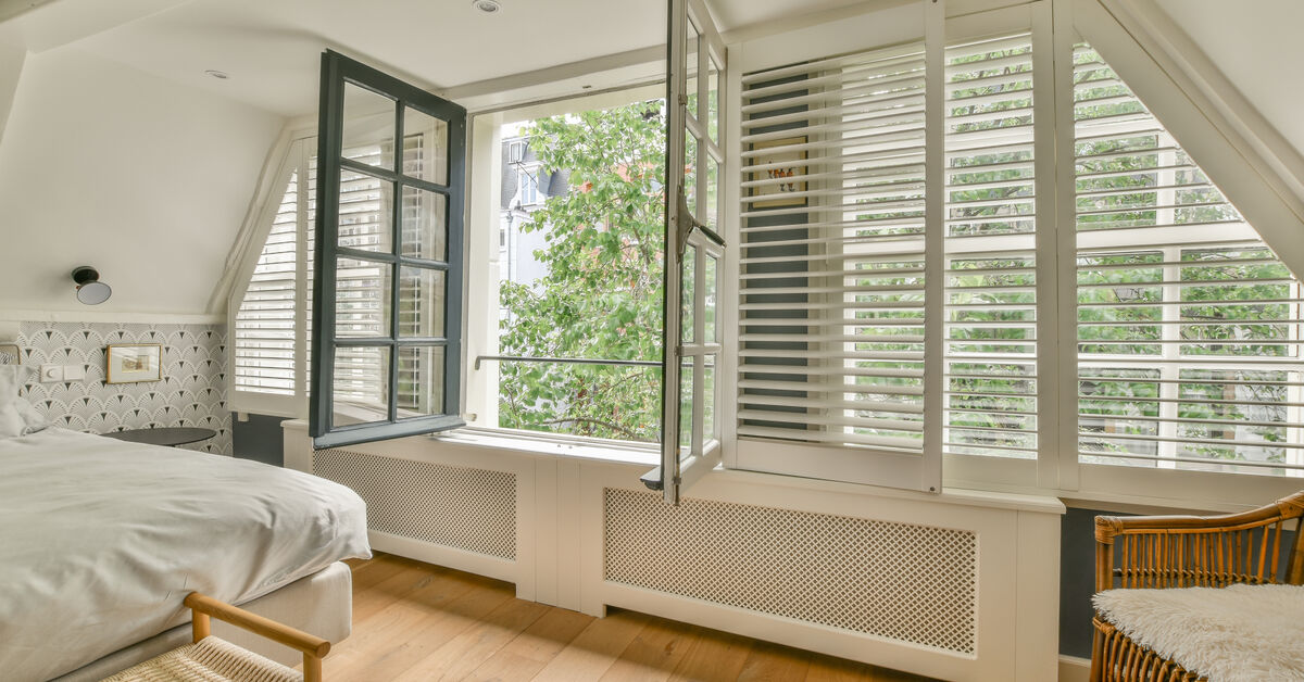 Clean bedroom with open window